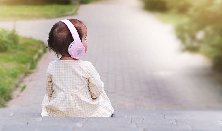 What role does music play in the development of language in babies?