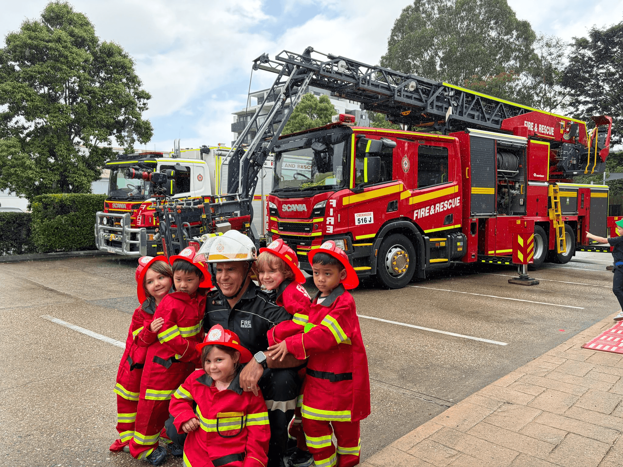 Not all heroes wear capes: Chermside children honour firefighters on National Superhero Day 