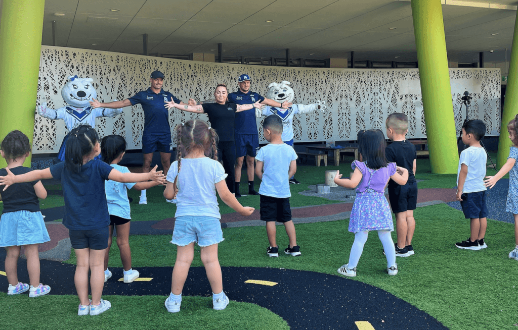 Young Academics work with Bulldogs on new warm up routine