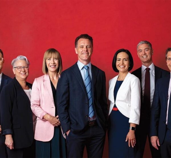 Image features members of the NSW Labor Party in 2023, against a solid red backdrop
