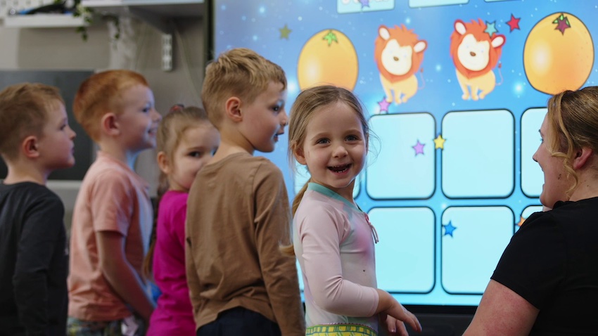 Children playing with BenQ board