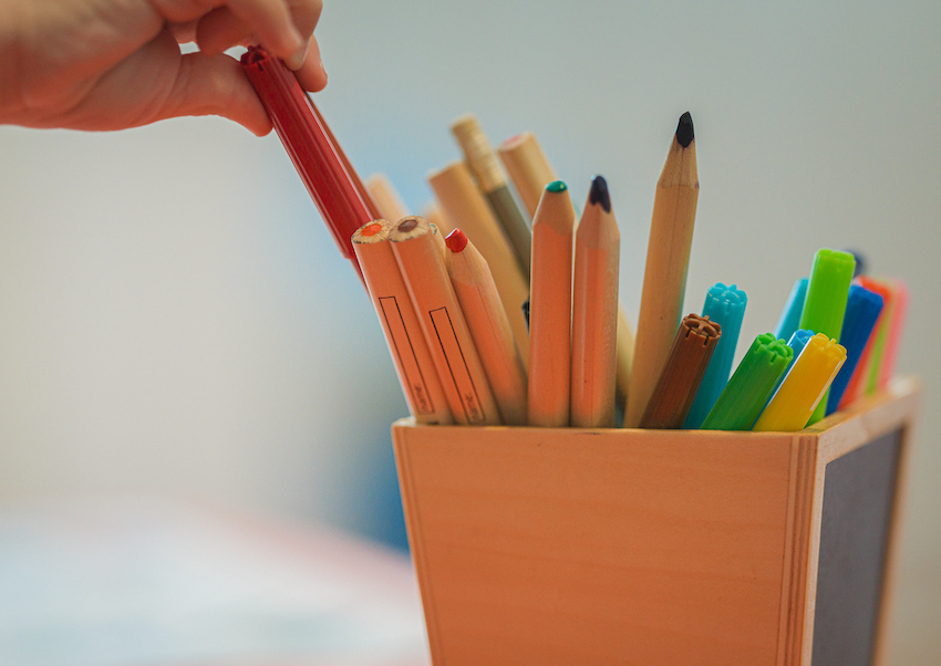 Picking pencils in child care centre