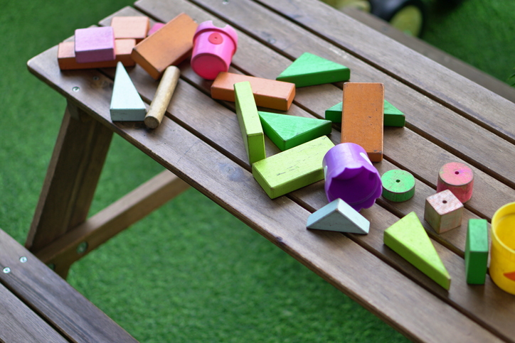 Wooden building blocks toys kid on the table - in child care centre